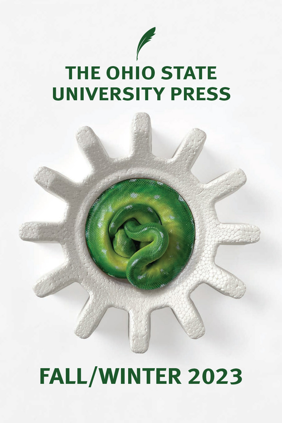Fall 2023 seasonal catalog cover showing a coiled green snake contained in a white, gear-shaped styrofoam enclosure against a white background, from the cover of Mary Quade's Zoo World